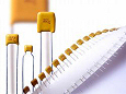 RoHS compliant radial dipped capacitors from Syfer